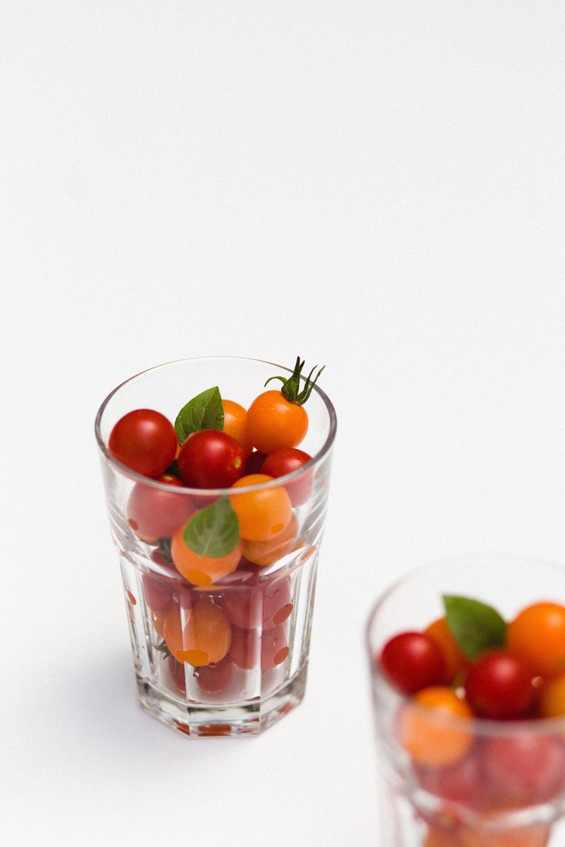 glass cups of fresh cherry tomatoes ready to eat, cherries from our garden 4k