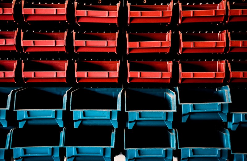 rows of storage bins the three on the top being red and the bottom two blue, a certain kind of symmetry 4k