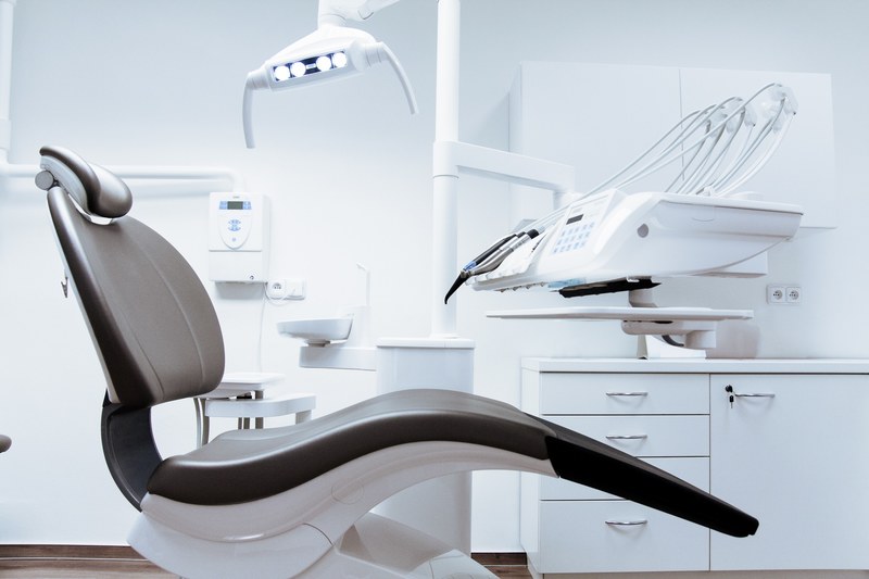 an empty leather chair in a dentist office, office 4k