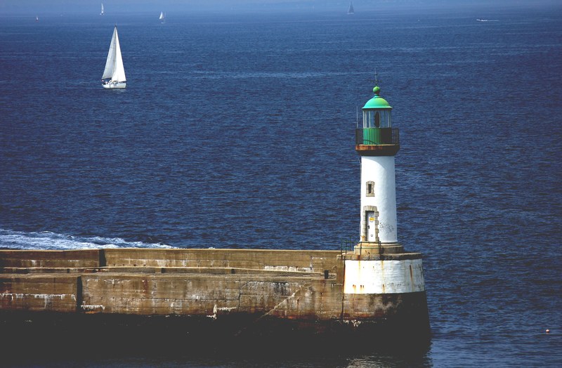 lighthouse ocean sea and sailboat 4k