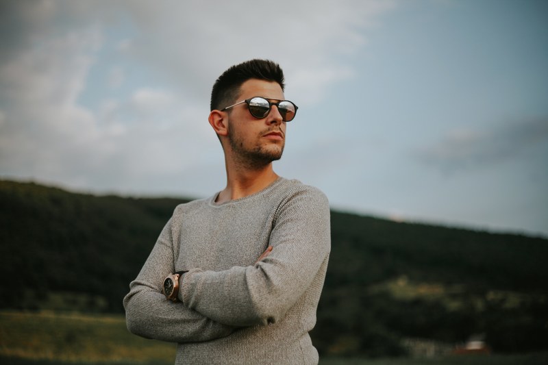 man looking out looking over and crossed arms 4k