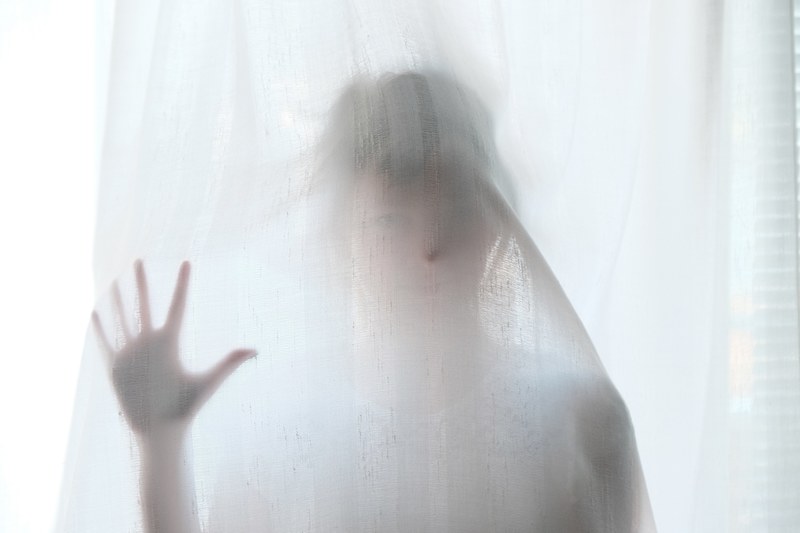 spooky woman behind the curtain, girl touching a shower curtain 4k