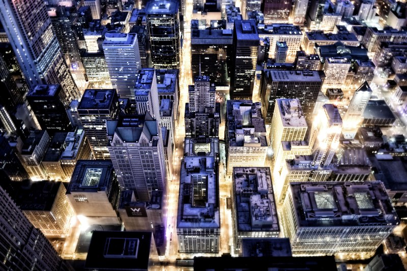 a high shot of the streets of chicago soaked in bright light, streets paved in gold 4k