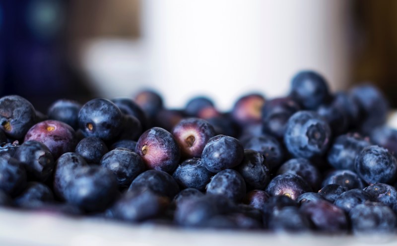 close up of a large amount of blueberries in a bowl, fresh fruit 4k