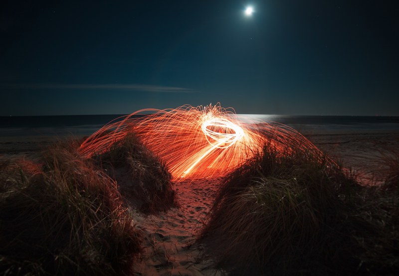 a steel wool light trail image captured on hampton beach, hampton beach light painting 4k