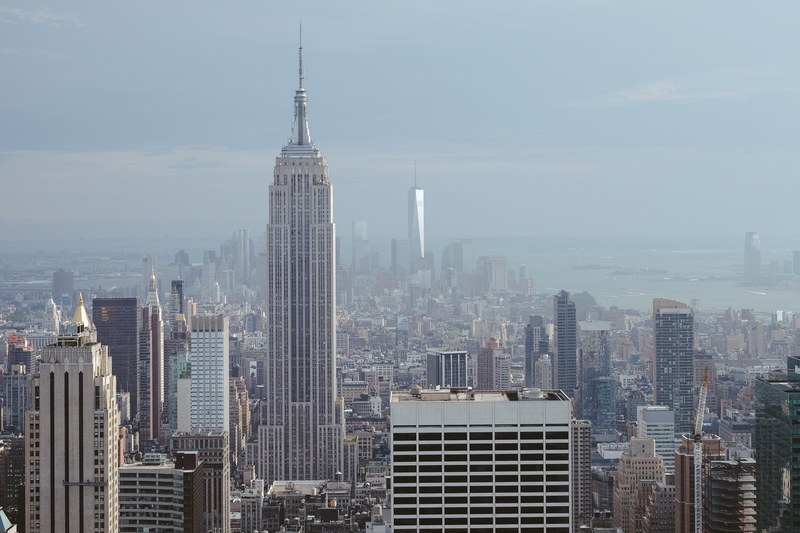 view of the empire state building and the financial district in the distance in new york city, my favorite skyscraper in the city 4k