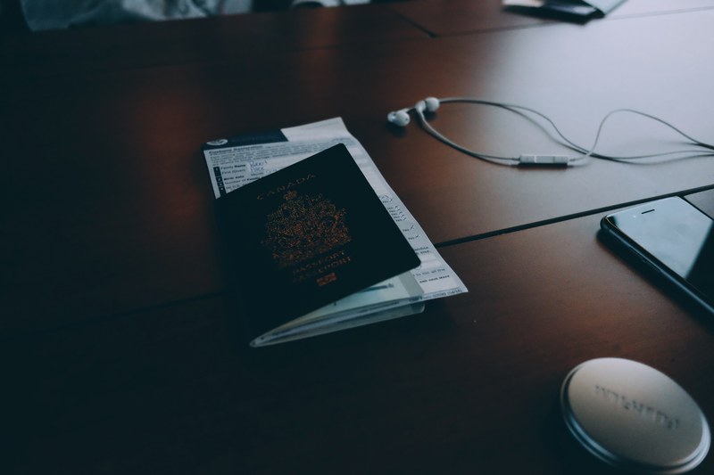 passport and documents on desk near phone and headphones, passport documents desk 4k