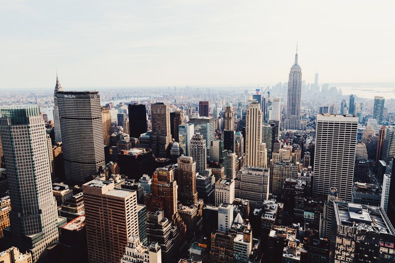the downtown new york city skyline from top of the rock during the day, nyc from rockefeller 4k
