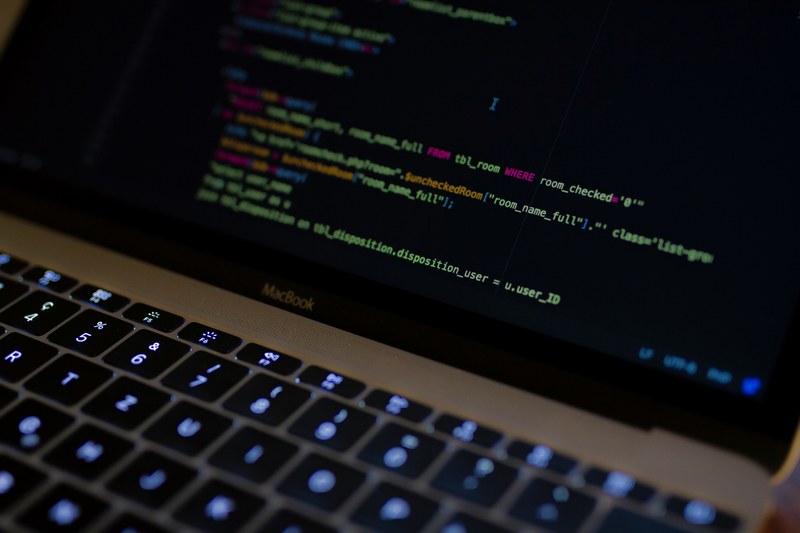 colorful lines of code on a macbook screen, coding sql in php 4k