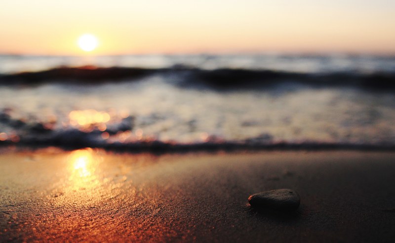beach sunset shot on the ground with a pebble, beach sunset on ground 4k