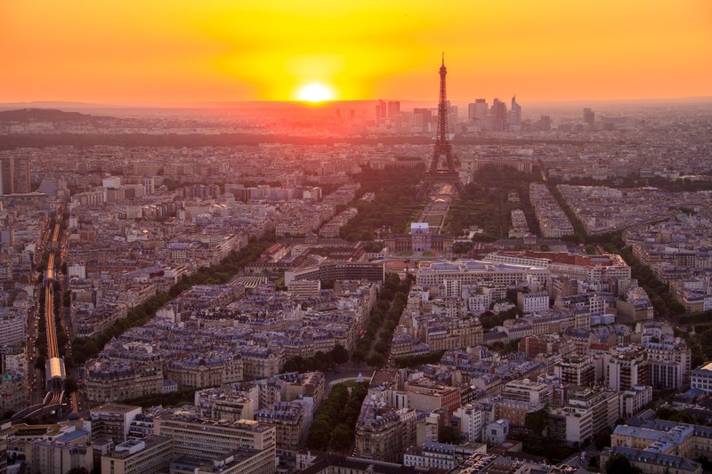 a high view of the champ de mars in paris with the eiffel tower during sunset, city of lights 4k