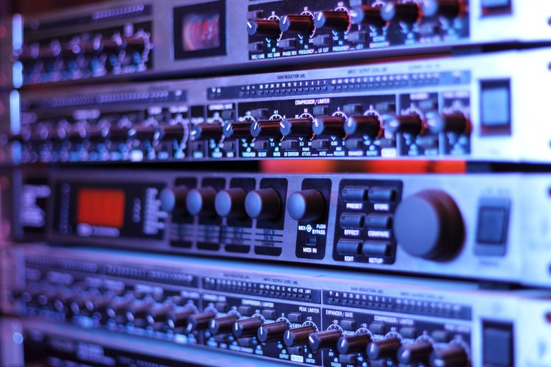 a close up of numerous dials on a piece of recording equipment, inside the creation of new music 4k