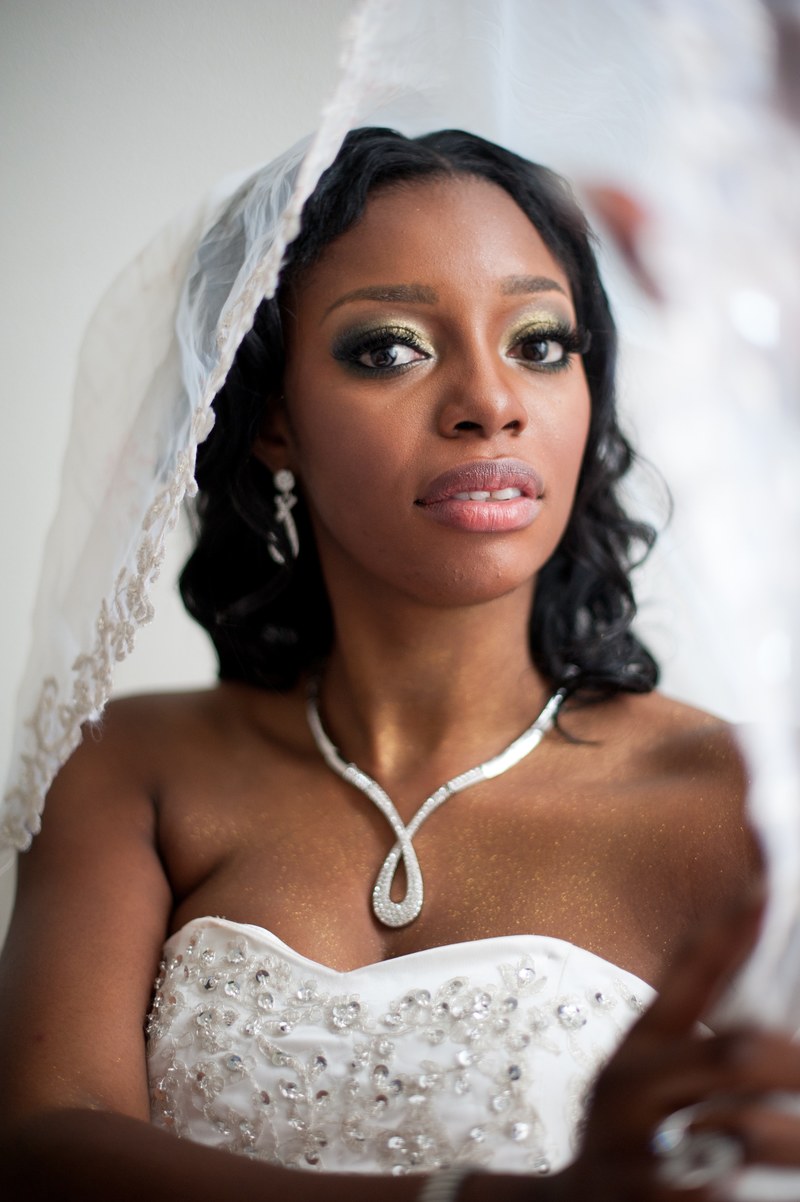 worried bride wearing a wedding dress and veil, beautiful black woman wedding 4k