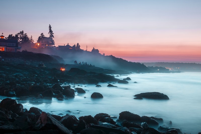 sunset on a rocky coastline of ogunquit where groups of people are watching an ocean mist rising from the waters, 4th of july maine sunset 4k