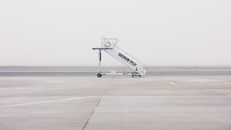 boarding stairs in the middle of an empty runway, aircraft stairs in the airport 4k