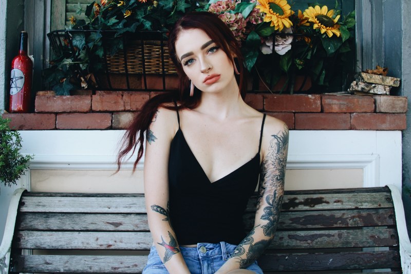 woman female tattoo and vest 4k
