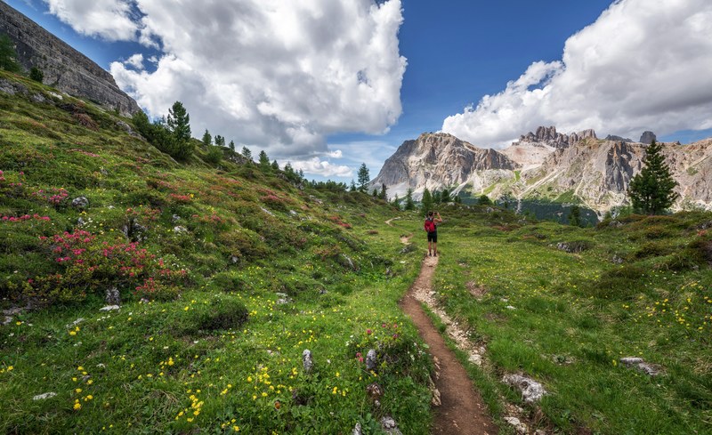 male hiker in the dolomites mountains 4k
