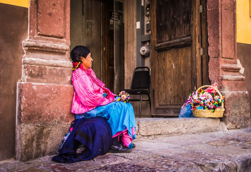 indigenous mexican woman selling dolls 4k