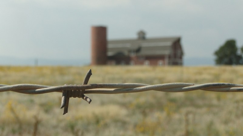 wire barbed wire field and barn 4k