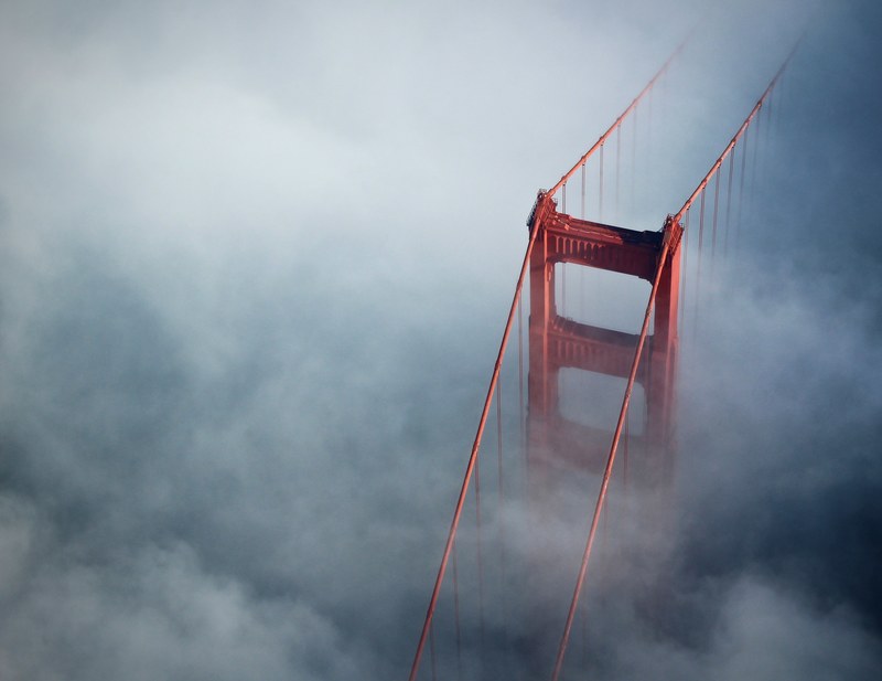 aerial view of golden gate bridge on a foggy day, above golden gate bridge 4k