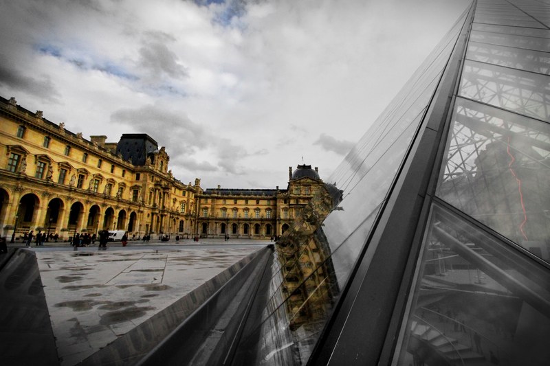 a glass window building next to a large pavement walking in france, _france glass building 4k