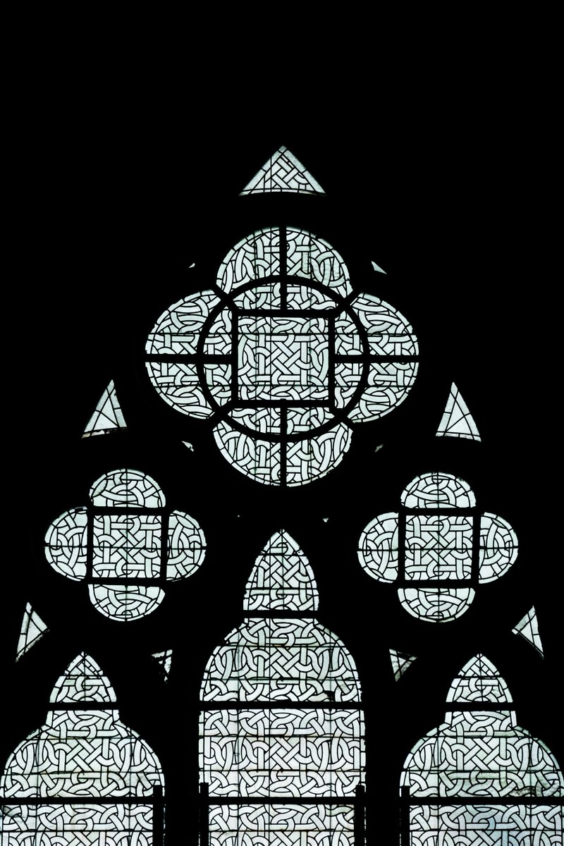intricate stained glass in a church in brussels 4k