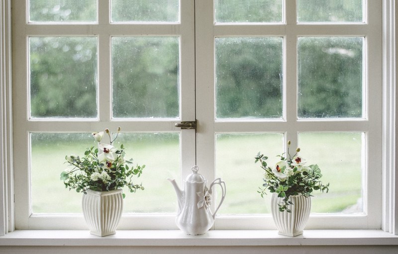 a porcelain teapot between two potted plants on a windowsill, porcelain teapot on windowsill 4k
