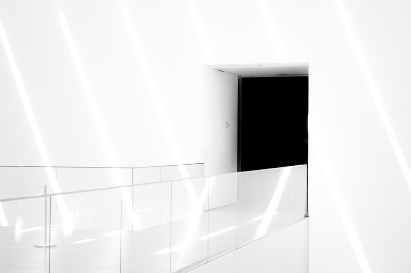modern architecture of white hallway passage and black door the museum of modern art, white passage leading to hallway 4k