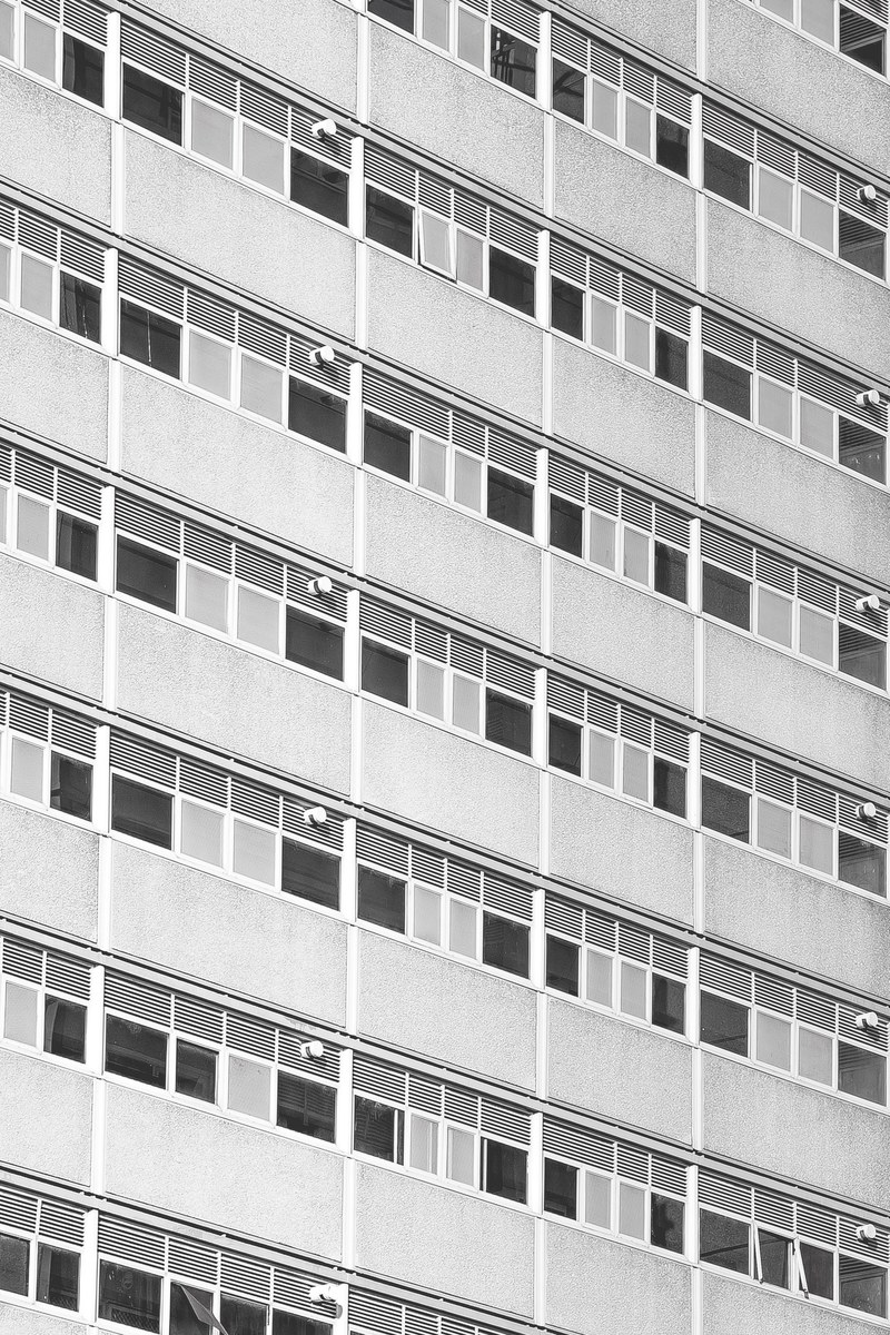 symmetrically designed architect of a high rise apartment building, _exterior side rental building 4k