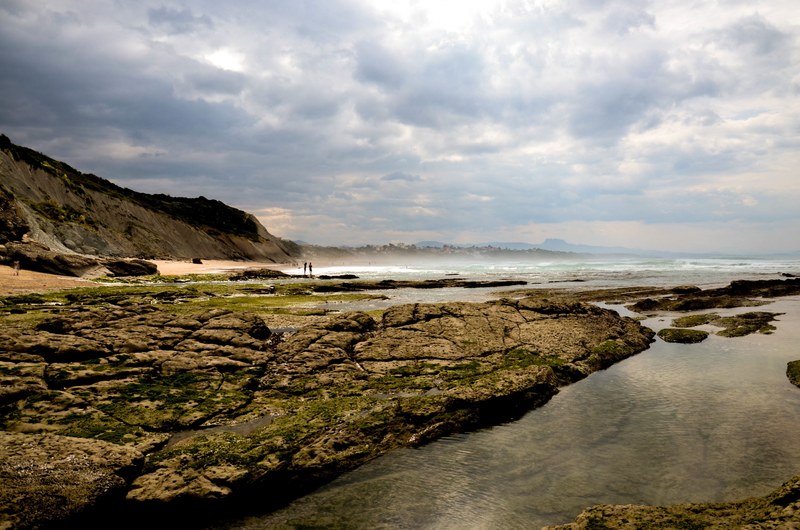 beach cliff rock and cloud 4k