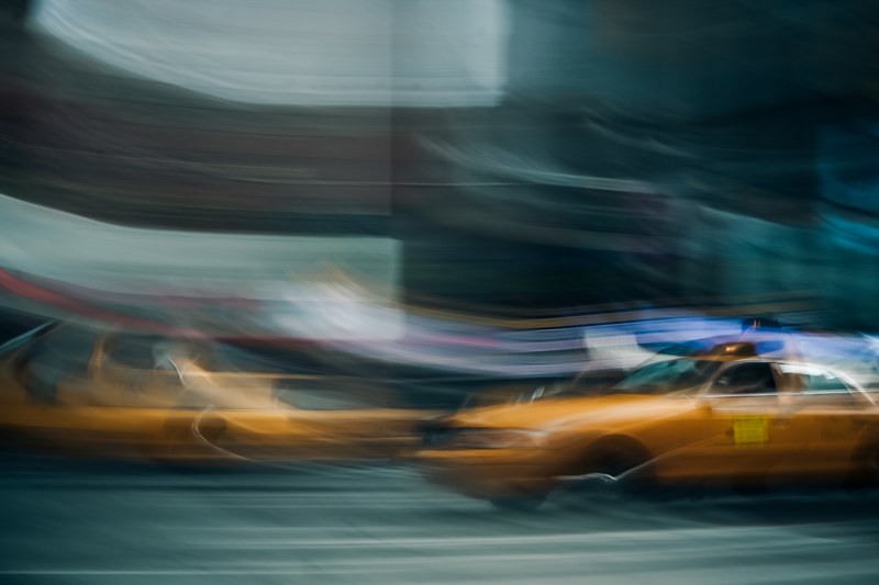 a blurry shot of a yellow taxi cab in new york city, blurry yellow taxi cab 4k