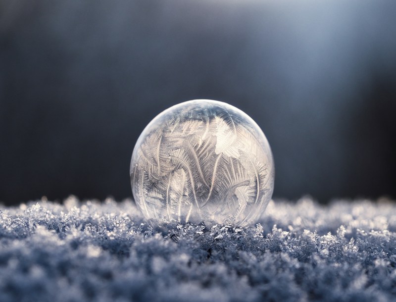 a macro view of a frozen winter ball on the cold winter ground, _macro view of frozen winter ball 4k