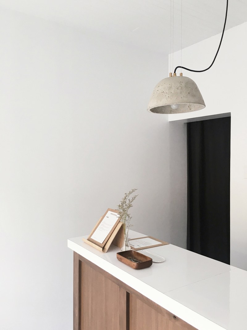 a white wooden counter in a store, welcome to ho 4k