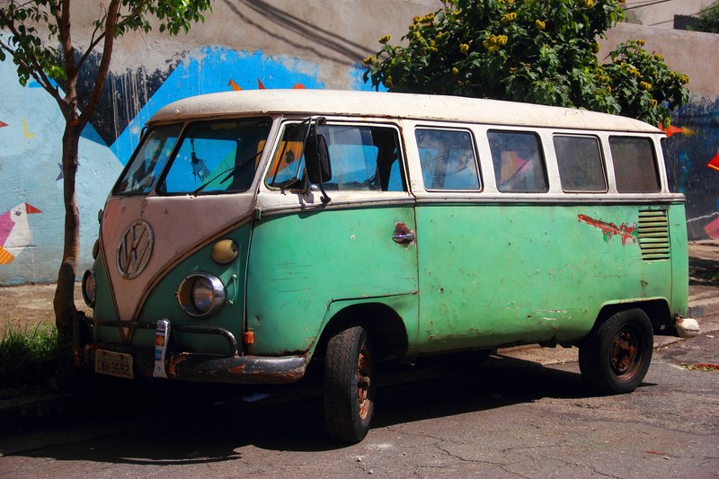 a vintage mint green volkswagen van parked in front of a mural in so paulo, so paulo vintage vw van 4k