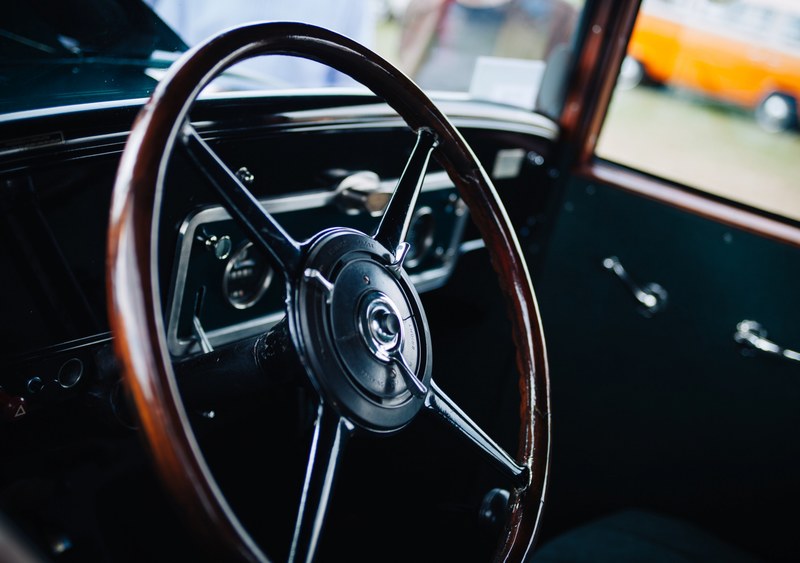 old vintage car interior with the wooden frame steering wheel, drive me 4k