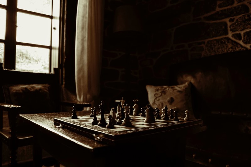 chess pieces on a board in a dark room, quiet place 4k