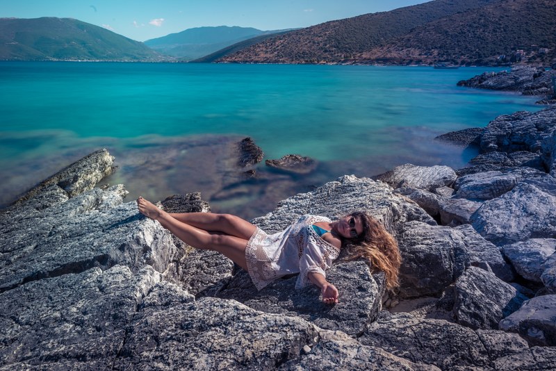 rocks woman blue and sea 4k