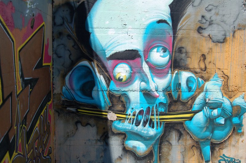 graffiti art of a character with a messed up looking face, _freaky face character graffiti 4k