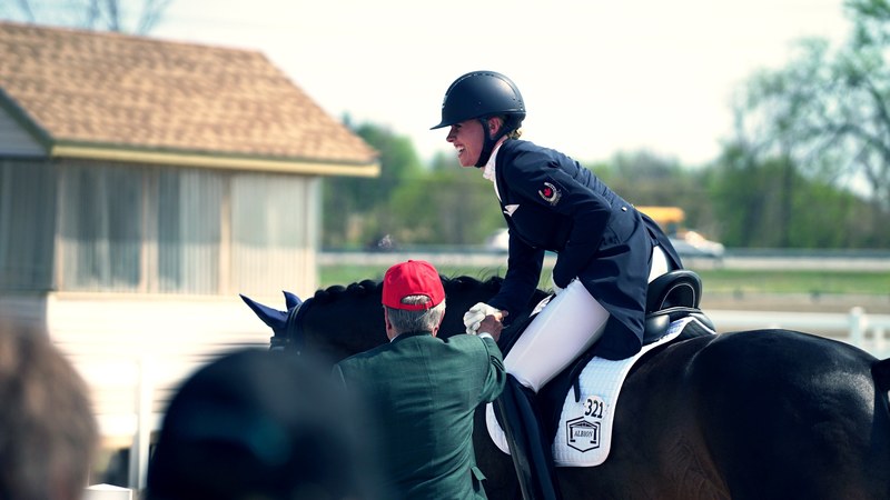 a woman equestrian rider sitting on her horse talking to her coach in ottawa, big finish 4k