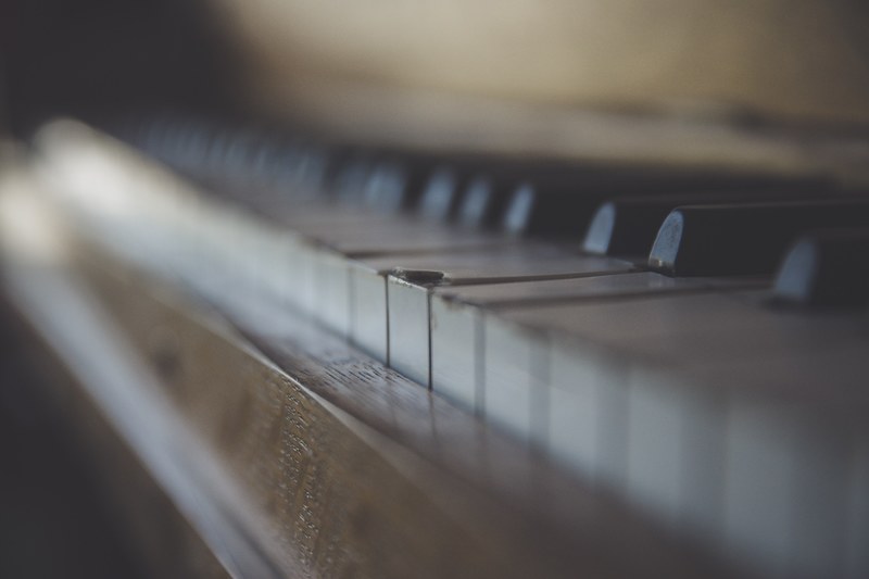 a blurry shot of the surface of a piano keyboard, broken keys 4k