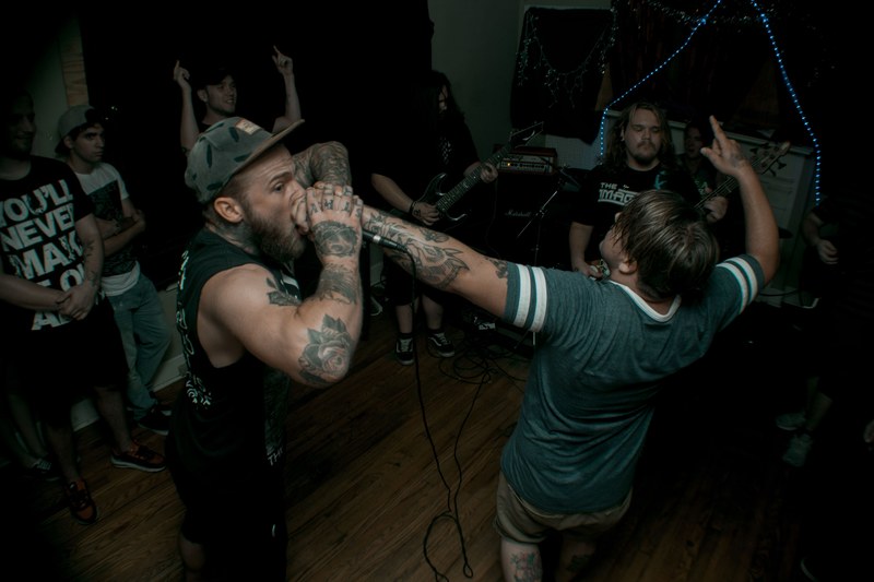 a rock band performing in a cramped apartment, local rock band at an apartment 4k