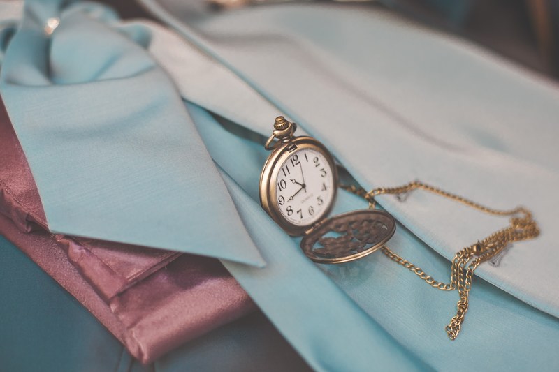 an antique pocket watch on a scarf, antique pocket watch 4k