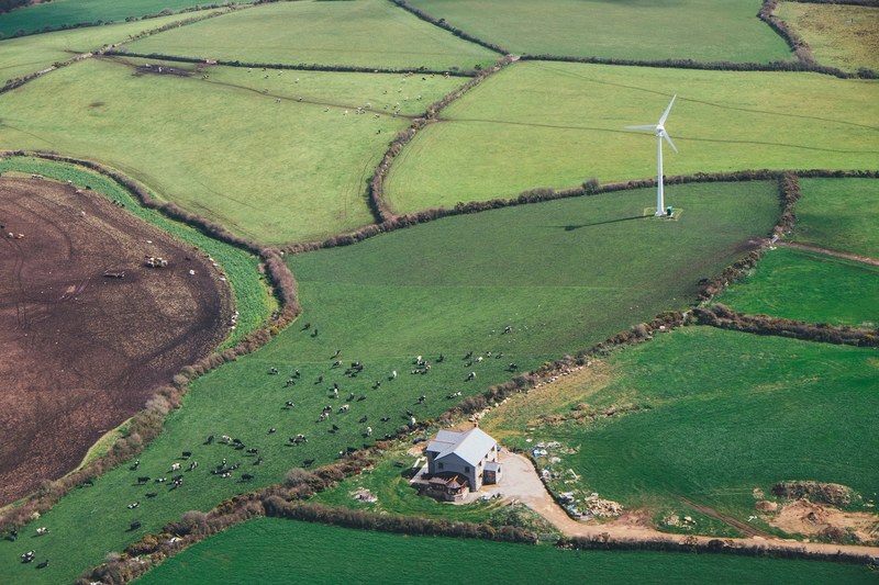 farm with wind turbine 4k