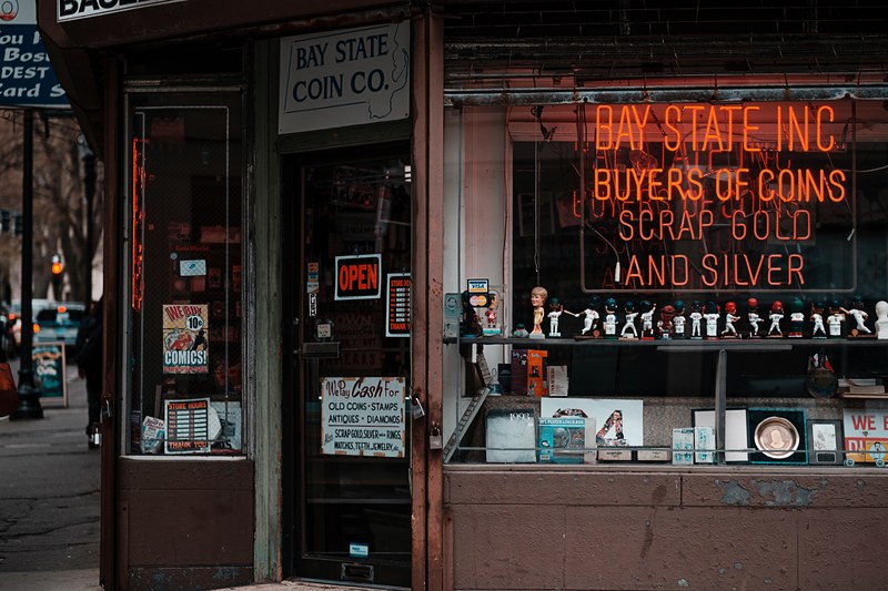 a coin and antique buyer storefront with a neon sign, antique buyer store 4k