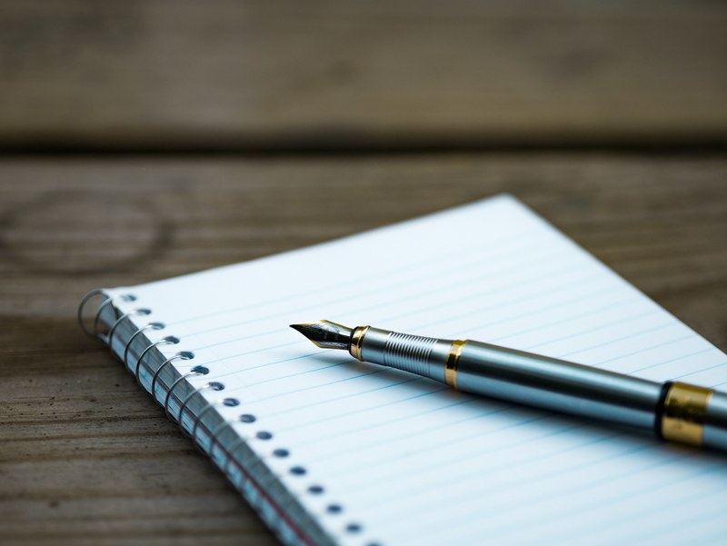 a fountain pen on a spiral notebook, fountain pen and a notebook 4k