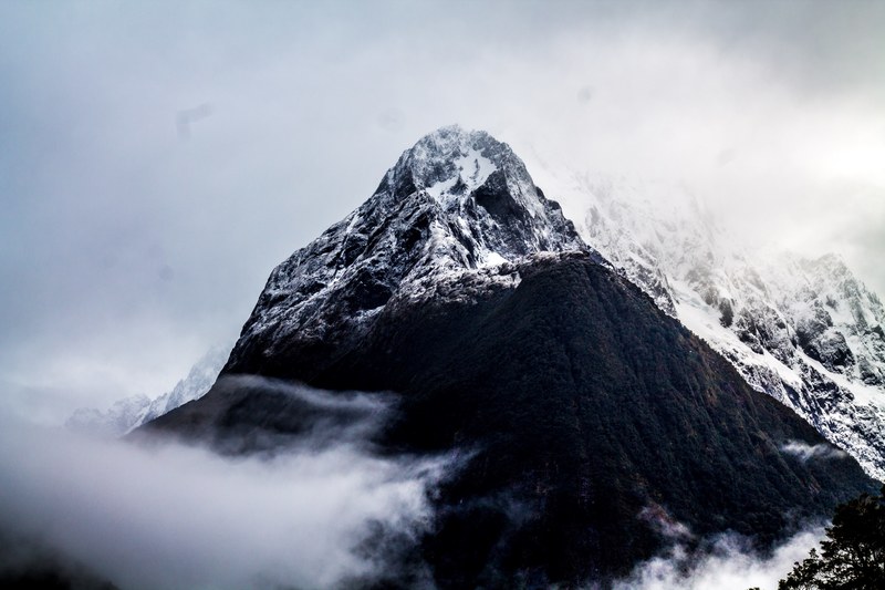 rugged peak rocky foggy and snowy peak 4k
