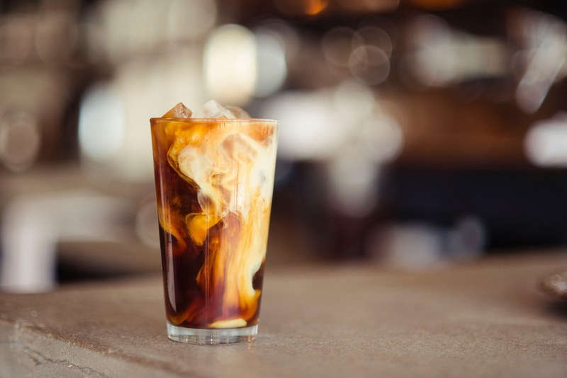 the macro view of a cold latte in a glass cup in denver, cold latte in a glass cup 4k