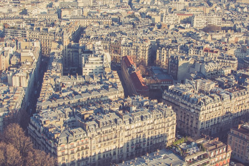 a drone shot of paris buildings with sepia tone, sepia paris buildings 4k