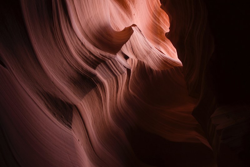 wavy patterns inside an orange sandstone cave, sandstone patterns 4k
