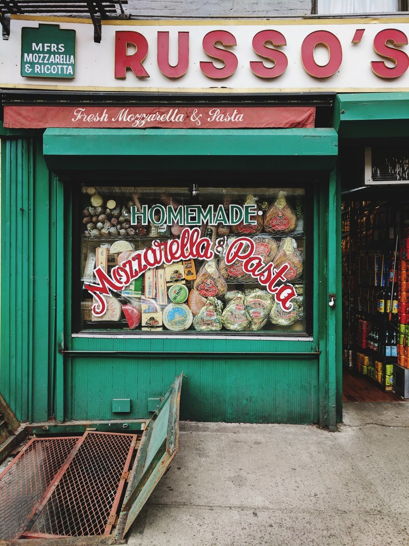 the storefront of a small store with homemade cheese and pasta in new york, homemade cheese store 4k